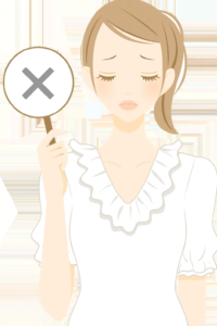 バツの札を片手に持った女性。残念な表情をしている。